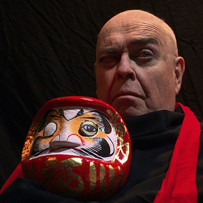 Both Eyes Open Performance Photo of Man in Red Robe with Mask